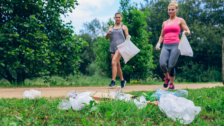 image of a person picking up thrash during their jog